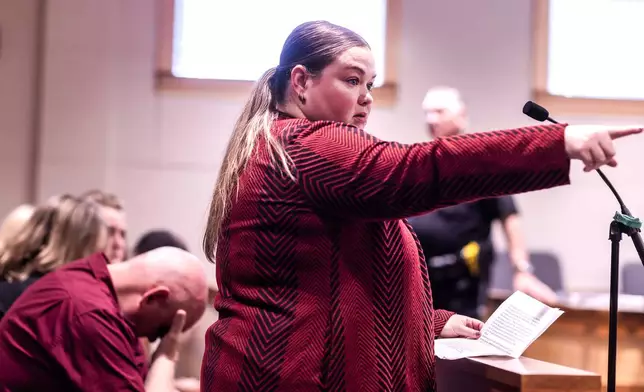 Kerri Carr points to Eric Sweeney during Sweeney's sentencing hearing at Merrimack Superior Court in Concord, N.H., on Friday, Oct. 3, 2025. (Geoff Forester/ Concord Monitor via AP, Pool)