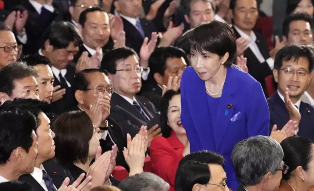 FILE - Former Economic Security Minister Sanae Takaichi, center right, bows as Takaichi was chosen as the new leader of Japan's ruling Liberal Democratic Party during the party's leadership election in Tokyo, Japan, Oct. 4, 2025. (Kyodo News via AP, File)