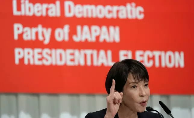 FILE - Japan's former Economic Security Minister Sanae Takaichi answers questions during a joint press conference by the Liberal Democratic Party (LDP) presidential election candidates at the party's headquarters, Sept. 23, 2025, in Tokyo. (AP Photo/Eugene Hoshiko, Pool, File)