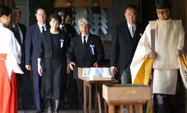 FILE - Japanese lawmakers, including Sanae Takaichi, center left, visit the Yasukuni Shrine to pay respect to the war dead on the day of the 69th anniversary of the end of the World War II, in Tokyo, on Aug. 15, 2014. (AP Photo/Koji Sasahara, File)
