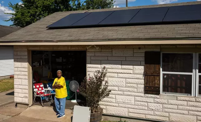Doris Brown, Hub home captain, poses for a portrait under her solar panels on Wednesday, Oct. 8, 2025, in Houston. (AP Photo/Antranik Tavitian)