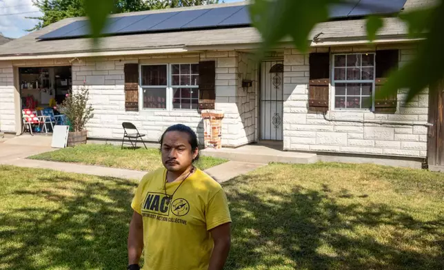 David Espinoza, Hub home captain and co-director of community organizing at West Street Recovery, stands in front of Doris Brown's hub home, Wednesday, Oct. 8, 2025, in Houston. (AP Photo/Antranik Tavitian)