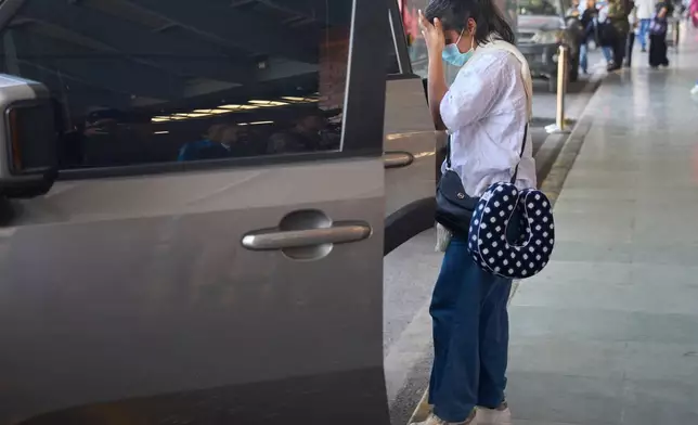 Pushpa Joshi, sister of Bipin Joshi, a Nepali man who was taken hostage by Hamas on Oct. 7, 2023, and was recently declared dead, arrives from the U.S. at Tribhuvan international airport in Kathmandu, Nepal, Thursday, Oct. 16, 2025. (AP Photo/Niranjan Shrestha)