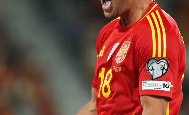 Spain's Martin Zubimendi celebrates after his teammate Mikel Oyarzabal scored during a World Cup 2026 Group E qualifying soccer match between Spain and Georgia at Manuel Martinez Valero stadium in Elche, Spain, Saturday, Oct. 11, 2025. (AP Photo/Alberto Saiz)