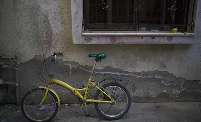 The bicycle of Saddam Rajab, a 10-year-old who was killed by an Israeli soldier, sits outside his mother's house in the West Bank city of Tulkarem, March 17, 2025. (AP Photo/Leo Correa)