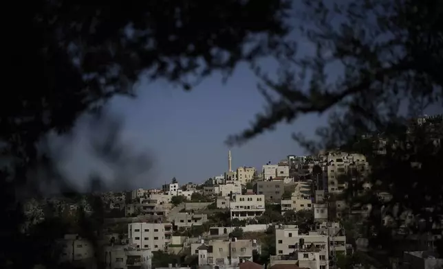 Houses and a mosque are visible in a section of the Jenin refugee camp in the West Bank, April 21, 2025. (AP Photo/Leo Correa)