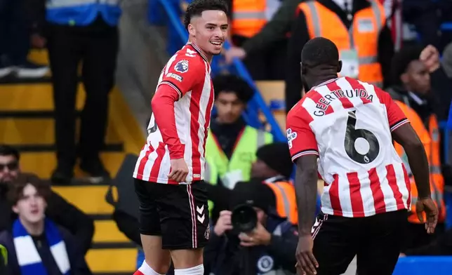 Sunderland's Chemsdine Talbi, left, celebrates scoring their side's second goal during the English Premier League soccer match between Chelsea and Sunderland at Stamford Bridge, London, Saturday Oct. 25, 2025. (John Walton/PA via AP)