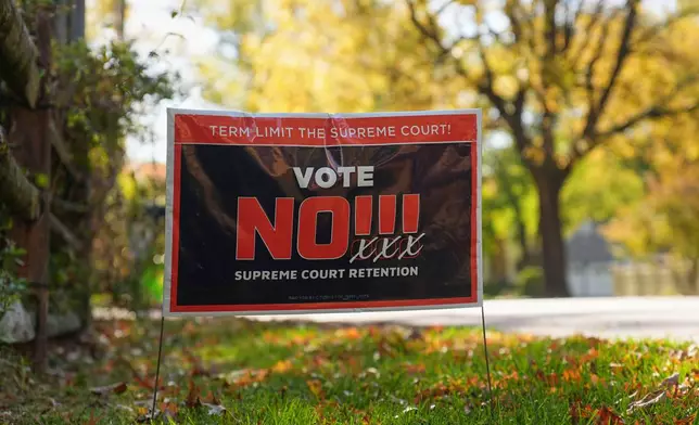 A sign is posted in opposition to retaining Pennsylvania Supreme Court justices in the November election, in Berwyn, Pa., Wednesday, Oct. 22, 2025. (AP Photo/Matt Rourke)