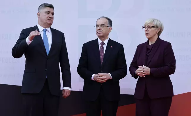From left to right Croatian President Zoran Milanovic , President of Albania Bajram Begaj, and Natasa Pirc Musar pose for a photo during the Brdo-Brijuni, Process Leaders' Meeting in Golem, Albania, 50 kilometers (30 miles) west of the capital, Tirana , Albania on Monday, Oct. 6, 2025 .(AP Photo/Vlasov Sulaj)