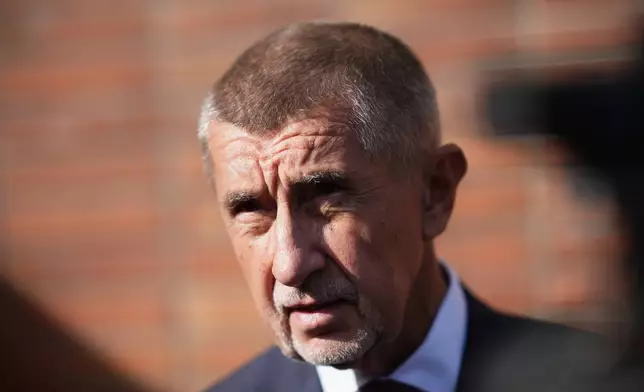 Chairman of opposition "ANO" (YES) movement Andrej Babis speaks to the media after casting his ballot for a general election at a polling station in Ostrava, Czech Republic, Friday, Oct. 3, 2025. (AP Photo/Petr David Josek)
