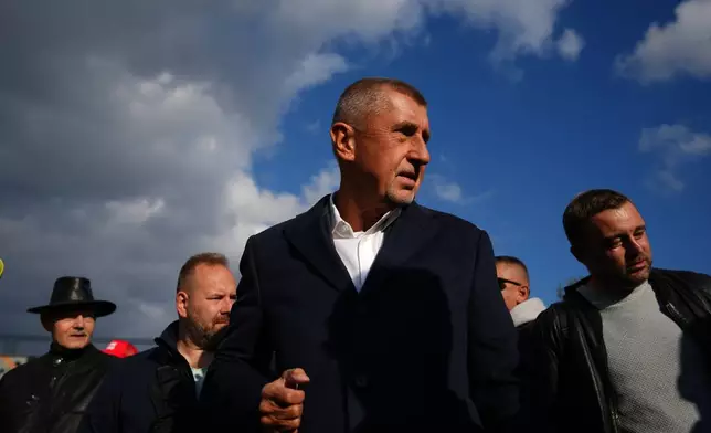 Chairman of opposition "ANO" (YES) movement Andrej Babis talks to his supporters during a rally ahead of Parliamentary elections in Prague, Czech Republic, Sept. 30, 2025. (AP Photo/Petr David Josek)