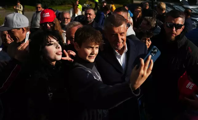 Chairman of opposition "ANO" (YES) movement Andrej Babis talks to his supporters during a rally ahead of Parliamentary elections in Prague, Czech Republic, Sept. 30, 2025. (AP Photo/Petr David Josek)