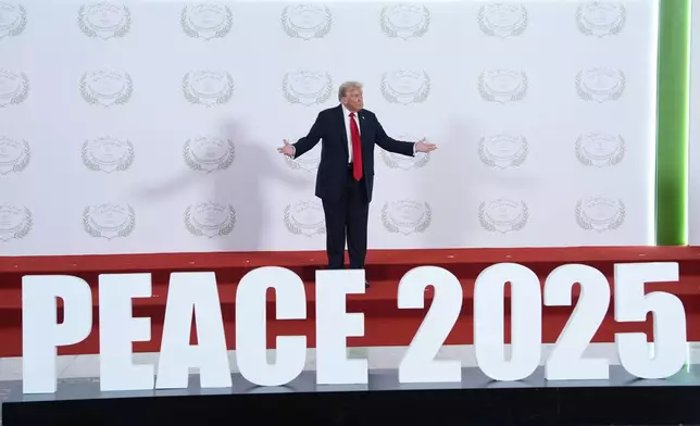 President Donald Trump waits to greet leaders during a summit to support ending the more than two-year Israel-Hamas war in Gaza after a breakthrough ceasefire deal, Monday, Oct. 13, 2025, in Sharm El Sheikh, Egypt. (AP Photo/Evan Vucci, Pool)