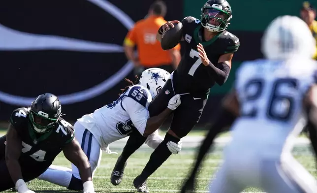 Dallas Cowboys' James Houston sacks New York Jets' Justin Fields during the first half of an NFL football game Sunday, Oct. 5, 2025, in East Rutherford, N.J. (AP Photo/Seth Wenig)