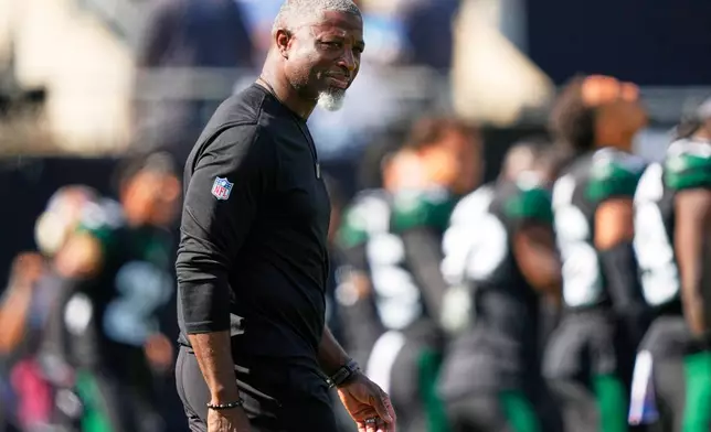 New York Jets head coach Aaron Glenn watches warm ups before an NFL football game against the Dallas Cowboys Sunday, Oct. 5, 2025, in East Rutherford, N.J. (AP Photo/Yuki Iwamura)