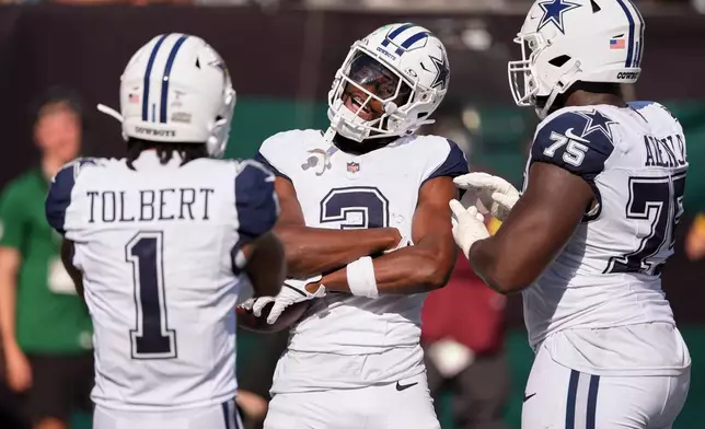 Dallas Cowboys' George Pickens celebrates his touchdown catch during the second half of an NFL football game against the New York Jets Sunday, Oct. 5, 2025, in East Rutherford, N.J. (AP Photo/Seth Wenig)
