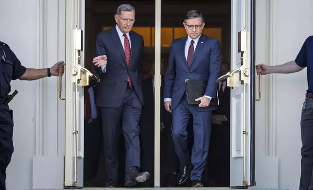 Sen. John Barrasso, R-Wyo., the Senate GOP whip, left, and Speaker of the House Mike Johnson, R-La., right, arrive for a news conference with top Republicans on the government shutdown, at the Capitol in Washington, Wednesday, Oct. 1, 2025. (AP Photo/J. Scott Applewhite)