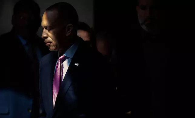 House Minority Leader Hakeem Jeffries, of N.Y., walks to a press conference on Capitol Hill on Wednesday, Oct. 1, 2025, in Washington. (AP Photo/Mark Schiefelbein)