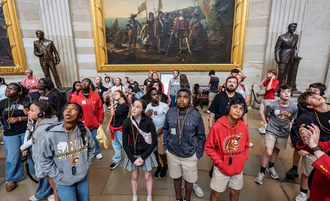 Visitors tour the Capitol Rotunda as the government lurches toward a shutdown at midnight if the Senate does not pass a House measure that would extend federal funding for seven weeks, at the Capitol in Washington, Tuesday, Sept. 30, 2025. (AP Photo/J. Scott Applewhite)