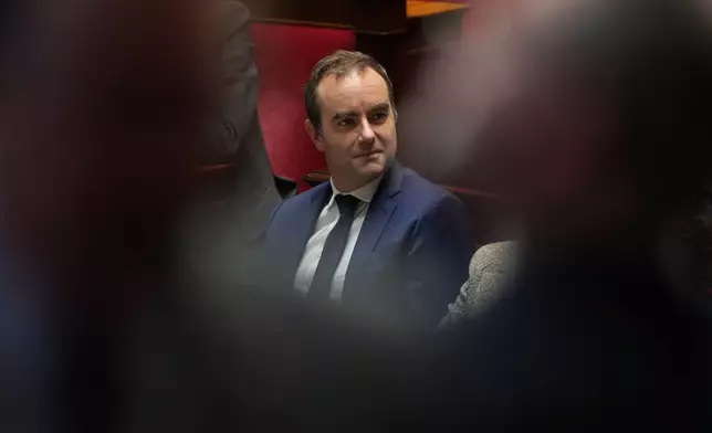 French Prime Minister Sebastien Lecornu listens to speeches before a no-confidence vote, Thursday, Oct. 16, 2025 at the National Assembly in Paris. (AP Photo/Thibault Camus)