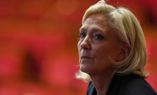 French far-right leader Marine Le Pen attends debates before a no-confidence vote, Thursday, Oct. 16, 2025 at the National Assembly in Paris. (AP Photo/Thibault Camus)