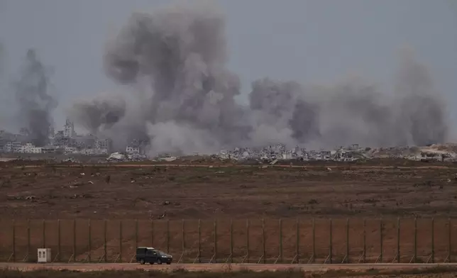 Smoke rises to the sky following an Israeli military strike in the Gaza Strip, as seen from southern Israel, Thursday, Oct. 9, 2025, following the announcement that Israel and Hamas have agreed to the first phase of a peace plan to pause the fighting. (AP Photo/Ariel Schalit)
