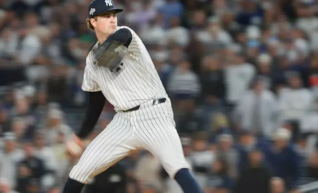 New York Yankees pitcher Cam Schlittler delivers against the Boston Red Sox during the eighth inning of Game 3 of an American League wild-card baseball playoff series, Thursday, Oct. 2, 2025, in New York. (AP Photo/Yuki Iwamura)