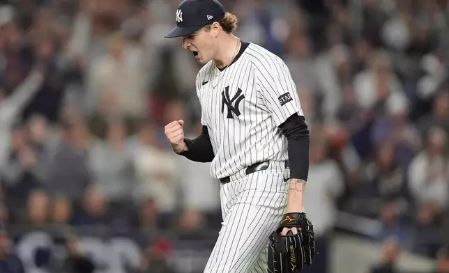 New York Yankees pitcher Cam Schlittler reacts as he walks off the field at the end of the top of the eighth inning of Game 3 of an American League wild-card baseball playoff series against the Boston Red Sox, Thursday, Oct. 2, 2025, in New York. (AP Photo/Frank Franklin II)