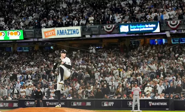 New York Yankees pitcher Cam Schlittler delivers against the Boston Red Sox during the eighth inning of Game 3 of an American League wild-card baseball playoff series, Thursday, Oct. 2, 2025, in New York. (AP Photo/Yuki Iwamura)