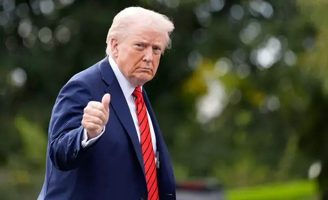 President Donald Trump walks on the South Lawn after arriving on Marine One at the White House, Friday, Oct. 10, 2025, in Washington. (AP Photo/Alex Brandon)