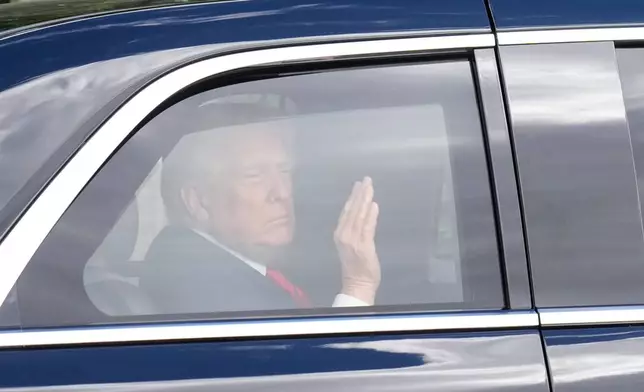 President Donald Trump departs Walter Reed National Military Medical Center in Bethesda, Md., Friday, Oct. 10, 2025. (AP Photo/Mark Schiefelbein)