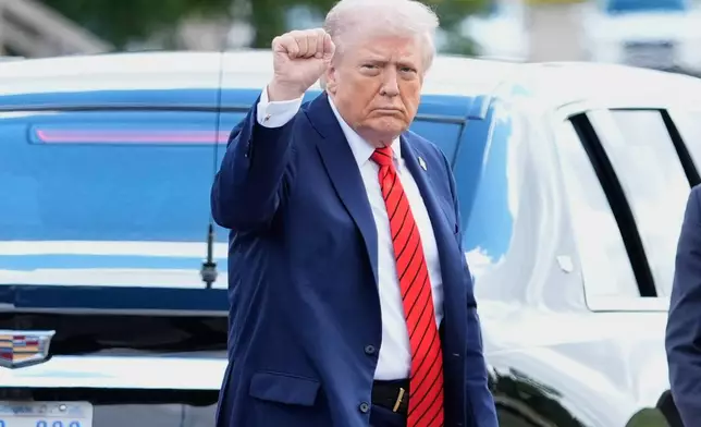 President Donald Trump departs Walter Reed National Military Medical Center in Bethesda, Md., Friday, Oct. 10, 2025. (AP Photo/Mark Schiefelbein)
