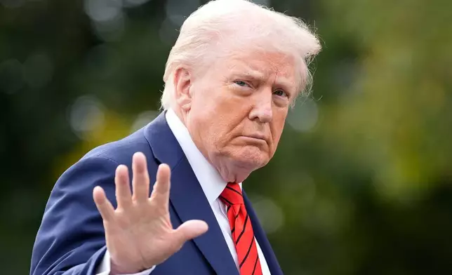 President Donald Trump walks on the South Lawn after arriving on Marine One at the White House, Friday, Oct. 10, 2025, in Washington. (AP Photo/Alex Brandon)