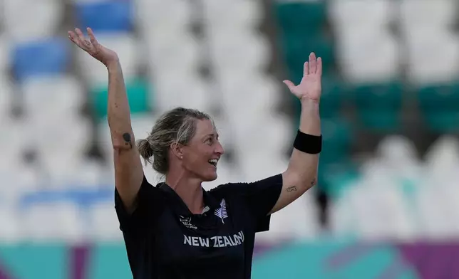 New Zealand's captain Sophie Devine celebrates the wicket of England's Heather Knight during the ICC Women's Cricket World Cup match between England and New Zealand at ACA–VDCA Cricket Stadium in Visakhapatnam, India, Sunday, Oct. 26, 2025. (AP Photo/Mahesh Kumar A.)