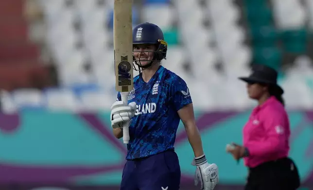 England's Amy Jones celebrates after scoring fifty runs during the ICC Women's Cricket World Cup match between England and New Zealand at ACA–VDCA Cricket Stadium in Visakhapatnam, India, Sunday, Oct. 26, 2025. (AP Photo/Mahesh Kumar A.)