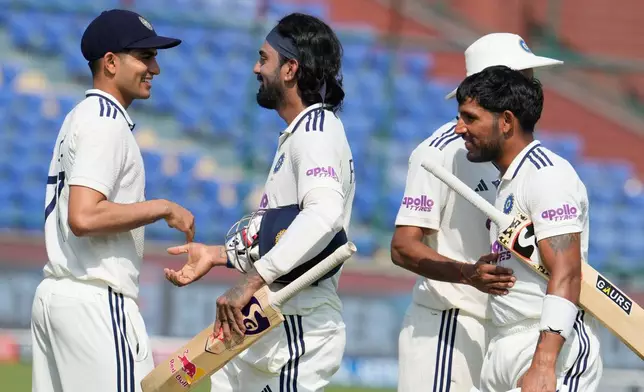 India's captain Shubman Gill congratulates teammate KL Rahul and wicketkeeper Dhruv Jurel on wining the second cricket test match between India and West Indies at the Arun Jaitley Stadium in New Delhi, India, Tuesday, Oct.14, 2025. (AP Photo/Manish Swarup)