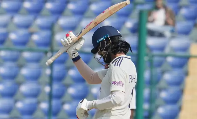 India's KL Rahul celebrates after scoring fifty runs on the fifth day of the second cricket test match between India and West Indies at the Arun Jaitley Stadium in New Delhi, India, Tuesday, Oct.14, 2025. (AP Photo/Manish Swarup)