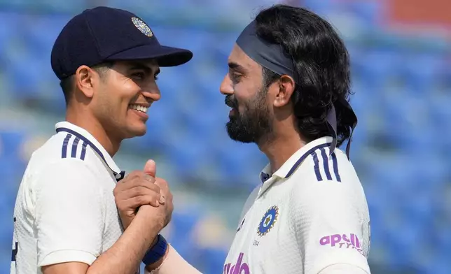 India's captain Shubman Gill congratulates teammate KL Rahul on wining the second cricket test match between India and West Indies at the Arun Jaitley Stadium in New Delhi, India, Tuesday, Oct.14, 2025. (AP Photo/Manish Swarup)