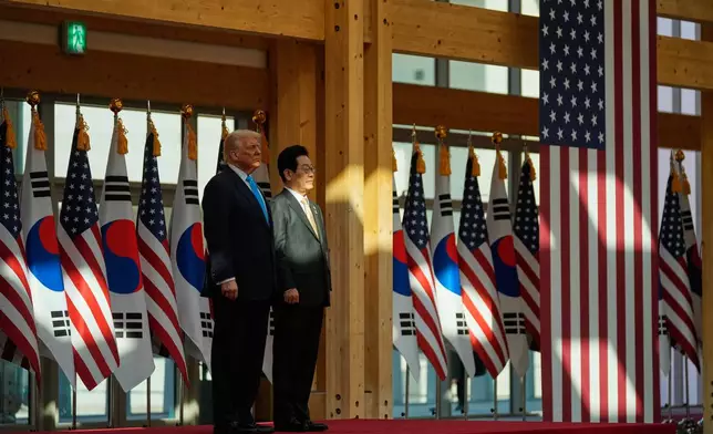 President Donald Trump, left, and South Korean President Lee Jae Myung attend a high honor ceremony at the Gyeongju National Museum in Gyoeongju, South Korea, Wednesday, Oct. 29, 2025. (AP Photo/Mark Schiefelbein)