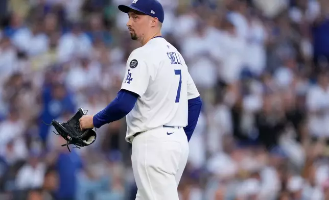 Los Angeles Dodgers' pitcher Blake Snell looks towards the Toronto Blue Jays dugout during the first inning in Game 5 of baseball's World Series, Wednesday, Oct. 29, 2025, in Los Angeles. (AP Photo/Ashley Landis)