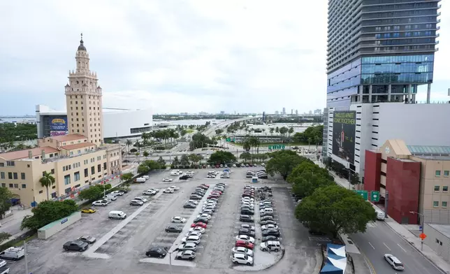 Republican Florida Gov. Ron DeSantis is proposing that President Donald Trump's presidential library be built in a parking lot that is currently used by Miami-Dade College staff and faculty and is adjacent to the Freedom Tower, Tuesday, Sept. 23, 2025, in Miami. (AP Photo/Marta Lavandier)