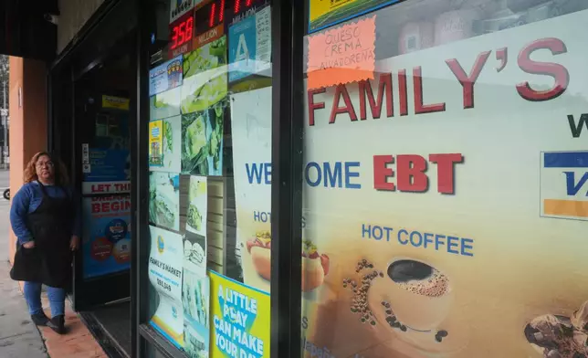 A sign indicates EBT cards are accepted at a market on Monday, Oct. 27, 2025, in Los Angeles. (AP Photo/Damian Dovarganes)