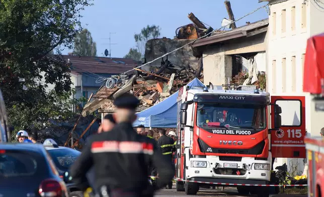 Policemen cordon off the scene of an explosion in the town of Castel d’Azzano, 10 km (six miles) southwest Verona, Italy, Tuesday, Oct. 14, 2025. (Claudio Furlan/LaPresse via AP)