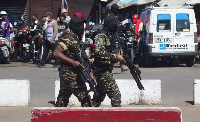Police patrol the streets during a protest calling for the president to step down in Antananarivo, Madagascar, Thursday, Oct. 9, 2025. (AP Photo/Alexander Joe)