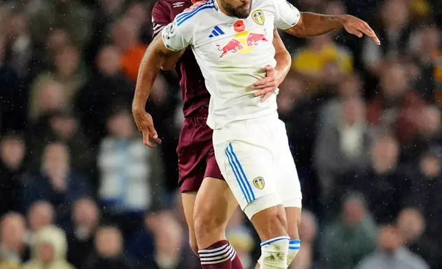 West Ham United's Max Kilman, rear, and Leeds United's Dominic Calvert-Lewin in action during the English Premier League soccer match between Leeds United and West Ham United at Elland Road, Leeds, England, Friday Oct. 24, 2025. (Danny Lawson/PA via AP)