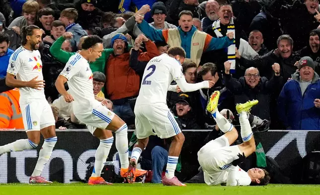 Leeds United's Brenden Aaronson, right, celebrates scoring with teammates during the English Premier League soccer match between Leeds United and West Ham United at Elland Road, Leeds, England, Friday Oct. 24, 2025. (Danny Lawson/PA via AP)