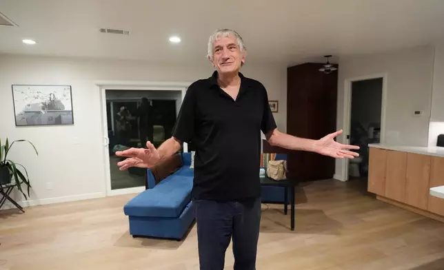 John Martinis stands in his living room after winning the Nobel Prize in Physics for his work on quantum tunneling on Tuesday, Oct. 7, 2025, in Santa Barbara, Calif. (AP Photo/Mark J. Terrill)