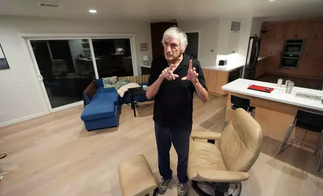 John Martinis stands in his living room after winning the Nobel Prize in Physics for his work on quantum tunneling on Tuesday, Oct. 7, 2025, in Santa Barbara, Calif. (AP Photo/Mark J. Terrill)