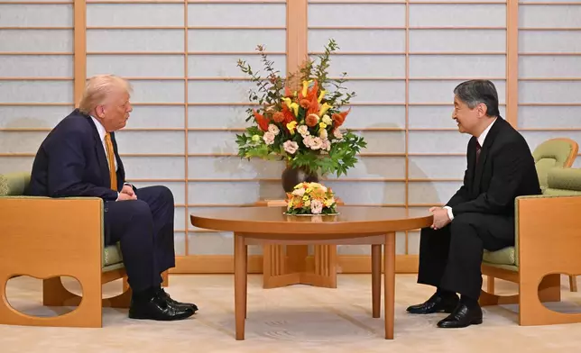 President Donald Trump, left, and Japan's Emperor Naruhito talk during their meeting at the Imperial Palace in Tokyo, Oct. 27, 2025. (Kazuhiro Nogi/Pool Photo via AP)