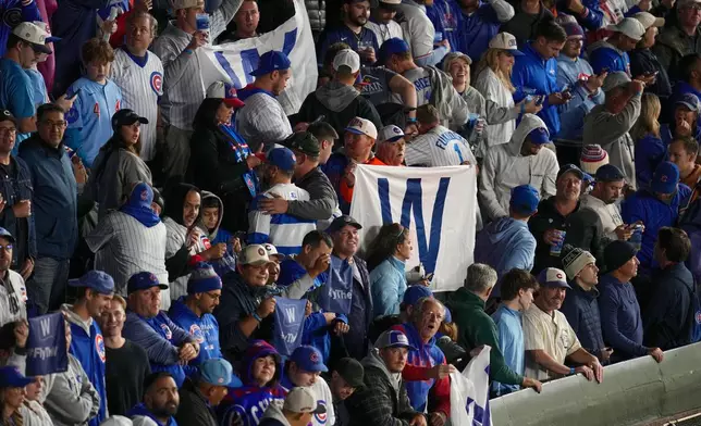 Chicago Cubs fans celebrate after Game 4 of baseball's National League Division against the Milwaukee Brewers Series Thursday, Oct. 9, 2025, in Chicago. (AP Photo/Erin Hooley)